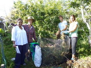 Farida, with Eric and Suria, wwoofers, at Tanya's compost-making  demo