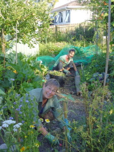 Julie (foreground) and Suria, wwoofer, weeding