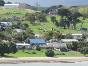 Our blue-roofed bach from Pahi, across the inlet